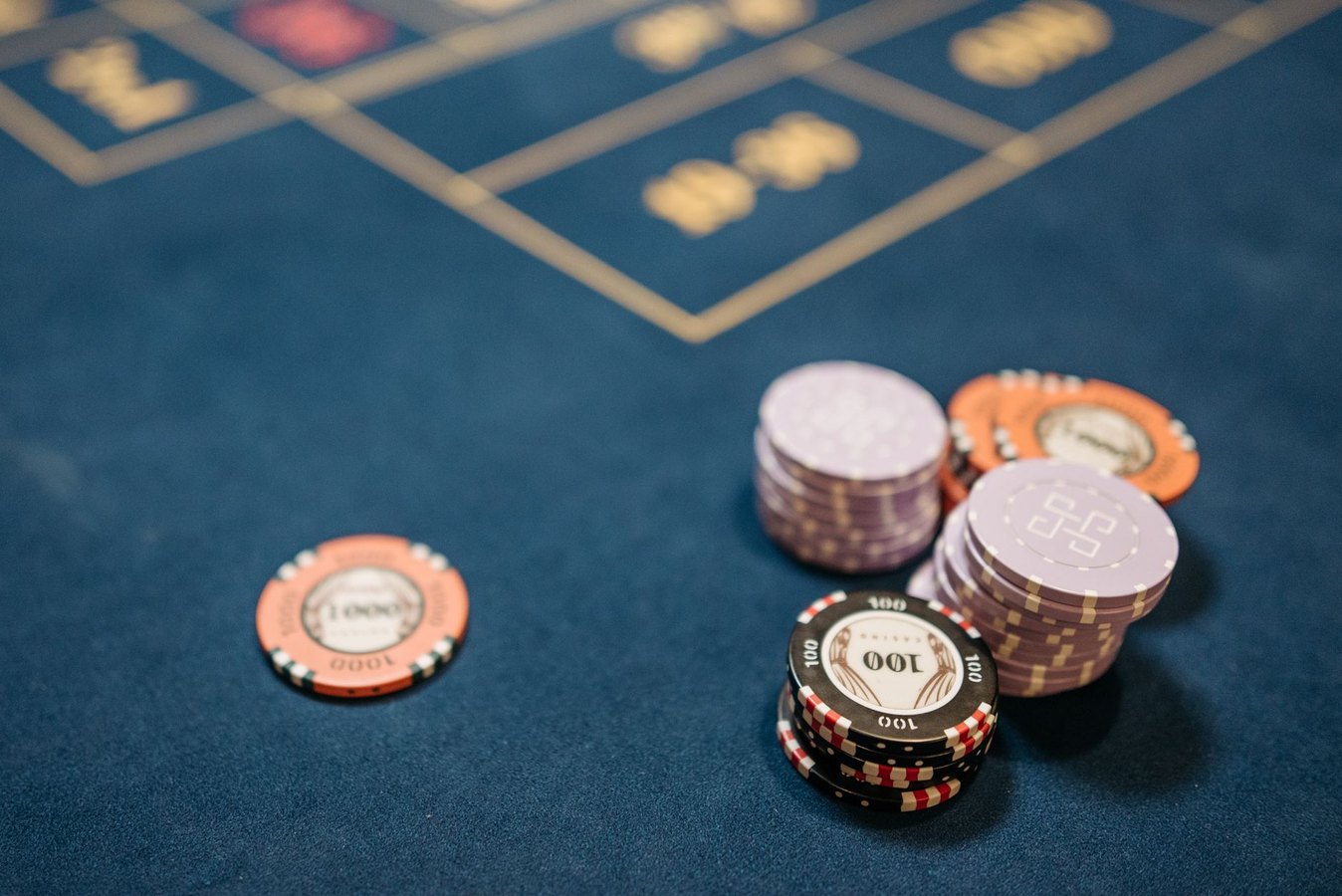 Modern casino floor with gaming tables and ambient lighting